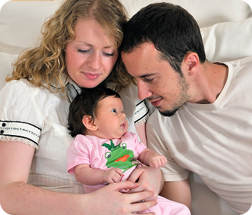 indoor-portrait-with-happy-young-family-cute-little-babby